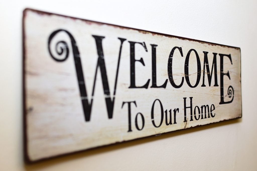 sign that reads "Welcome to our Home"